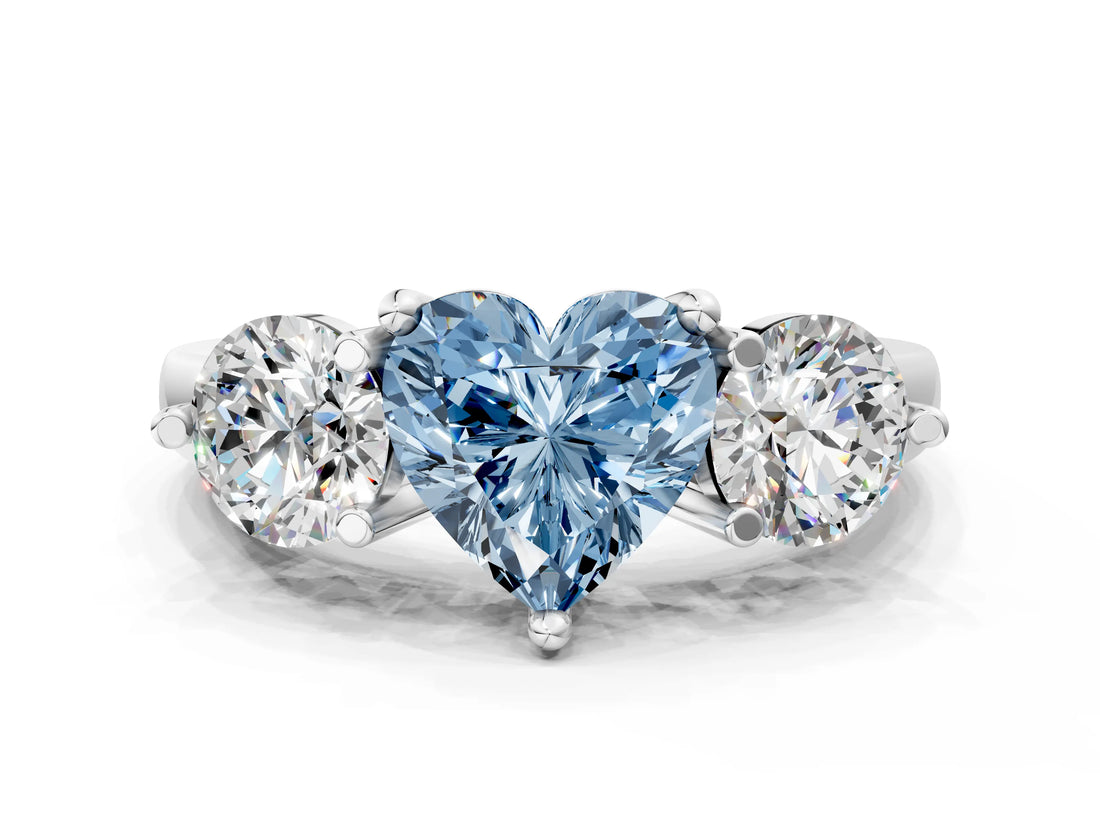 Platinum Three-Stone Fancy Blue Heart  Brilliant Cut Solitaire Ring with Prong Setting on a Classic Band