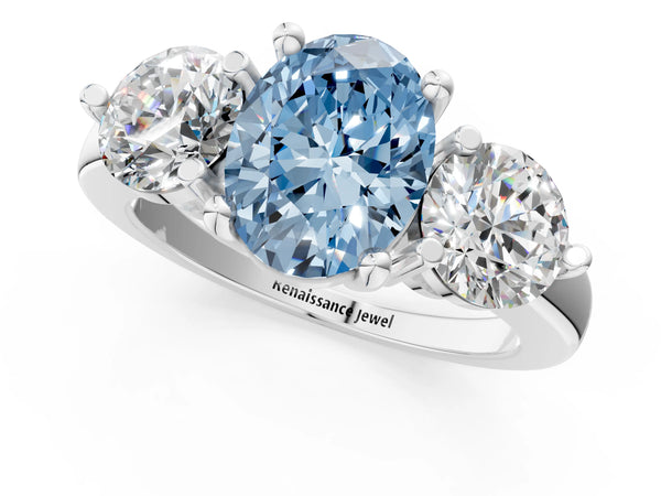 Platinum Three-Stone Fancy Blue Oval  Brilliant Cut Solitaire Ring with Prong Setting on a Classic Band