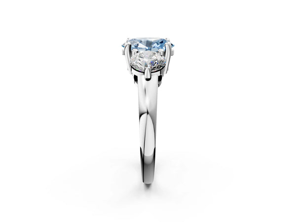 Platinum Three-Stone Fancy Blue Oval  Brilliant Cut Solitaire Ring with Prong Setting on a Classic Band