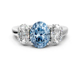 Platinum Three-Stone Fancy Blue Oval Cut Cut Diamond Ring with Channel Set Band and Four-Prong Setting_24