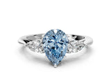 Platinum Three-Stone Fancy Blue Pear Cut Diamond Ring with Pear  Side Stones in Four-Prong Setting_12