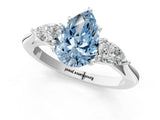 Platinum Three-Stone Fancy Blue Pear Cut Diamond Ring with Pear  Side Stones in Four-Prong Setting_13