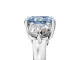 Platinum Three-Stone Fancy Blue Radiant  Brilliant Cut Solitaire Ring with Prong Setting on a Classic Band