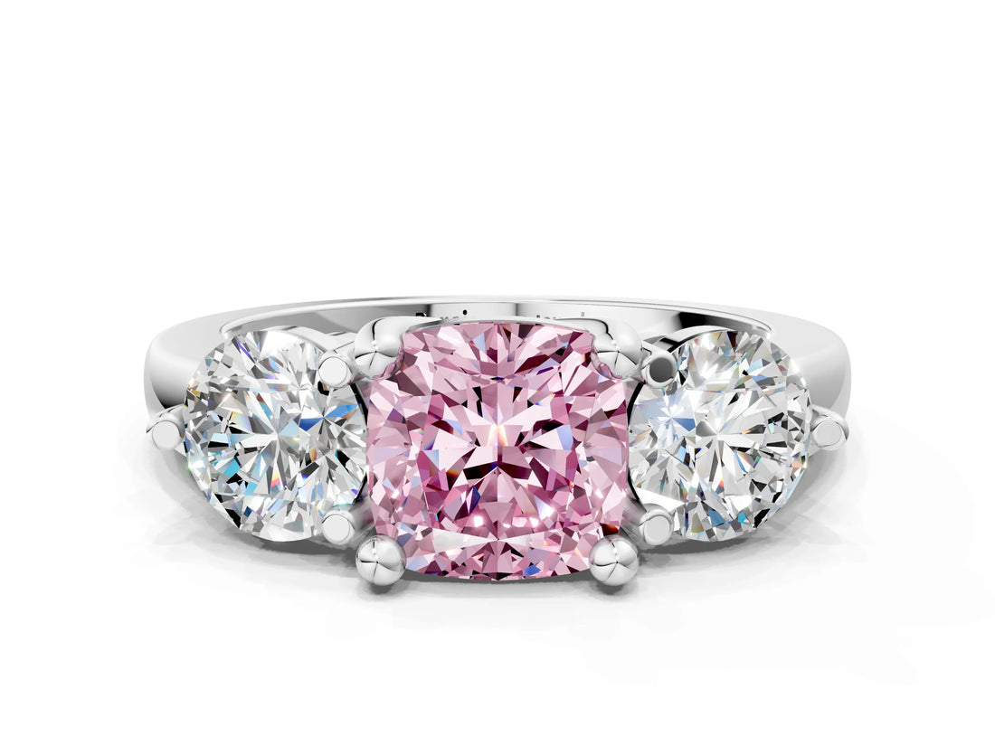 Platinum Three-Stone Fancy Pink Cushion  Brilliant Cut Solitaire Ring with Prong Setting on a Classic Band