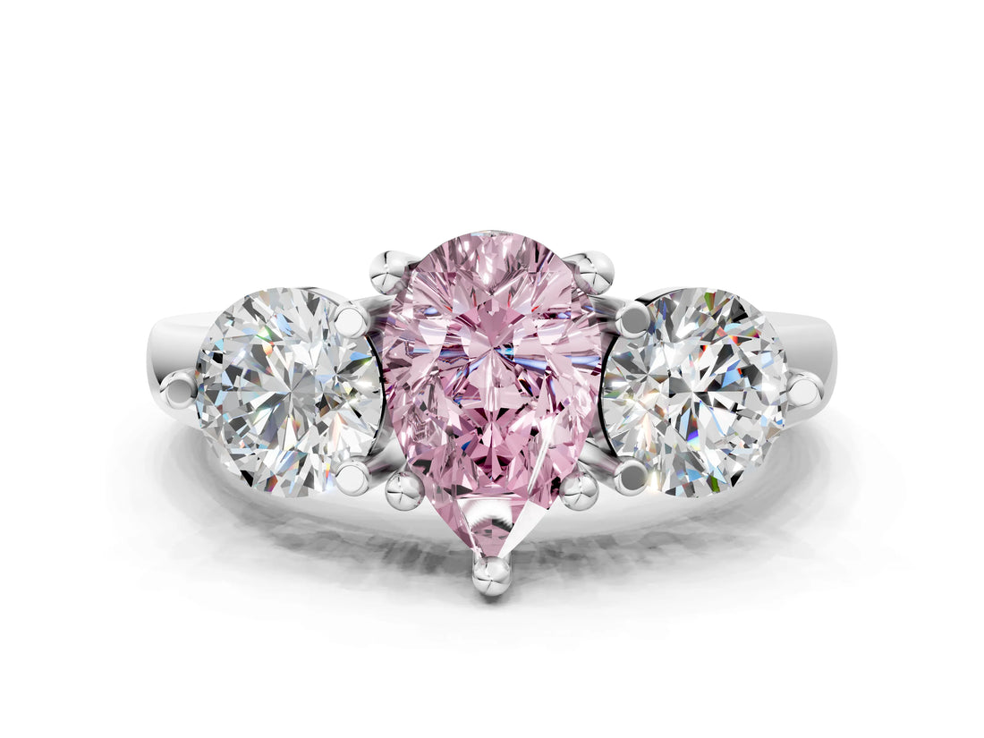 Platinum Three-Stone Fancy Pink Pear  Brilliant Cut Solitaire Ring with Prong Setting on a Classic Band