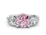 Platinum Three-Stone Fancy Pink Round  Brilliant Cut Solitaire Ring with Prong Setting on a Classic Band 2