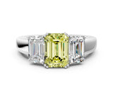 Platinum Three-Stone Fancy Yellow Emerald Cut Cut Diamond Ring with Channel Set Band and Four-Prong Setting_24