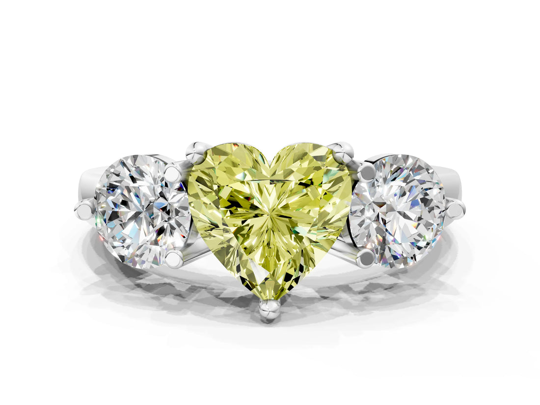 Platinum Three-Stone Fancy Yellow Heart  Brilliant Cut Solitaire Ring with Prong Setting on a Classic Band
