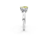 Platinum Three-Stone Fancy Yellow Oval Cut Cut Diamond Ring with Channel Set Band and Four-Prong Setting_21