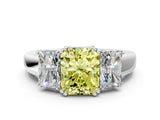Platinum Three-Stone Fancy Yellow Radiant Cut Cut Diamond Ring with Channel Set Band and Four-Prong Setting_37