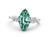 Platinum Three-Stone Marquise Cut Green Sapphire Ring with Pear  Side Stones in Four-Prong Setting_60