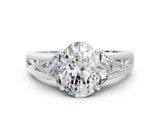 Platinum Three-Stone Oval Cut Cut Diamond Ring with Trillion Side Stones on a Split Shank Band_19