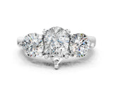 Platinum Three-Stone Pear Brilliant Cut Solitaire Ring with Prong Setting on a Classic Band