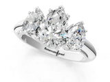 Platinum Three-Stone Pear Cut Diamond Engagement Ring with Prong Setting on a White Gold Band_51