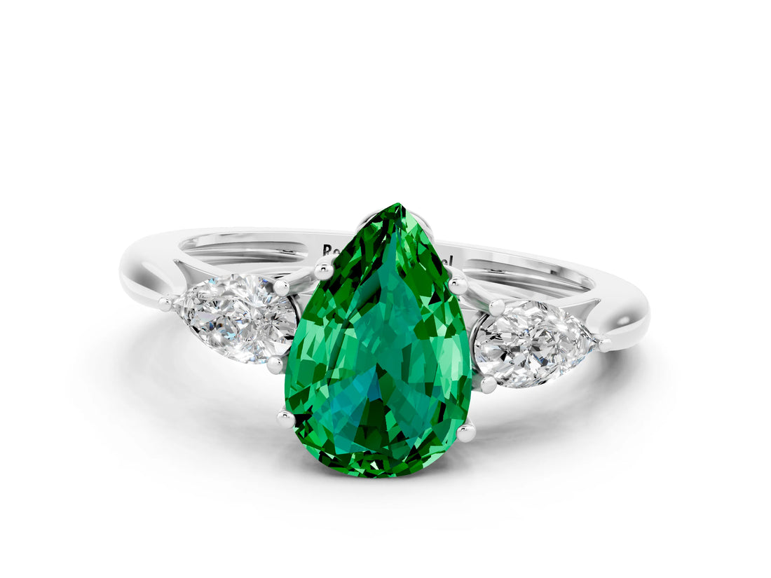 Platinum Three-Stone Pear Cut Emerald Ring with Pear  Side Stones in Four-Prong Setting_54