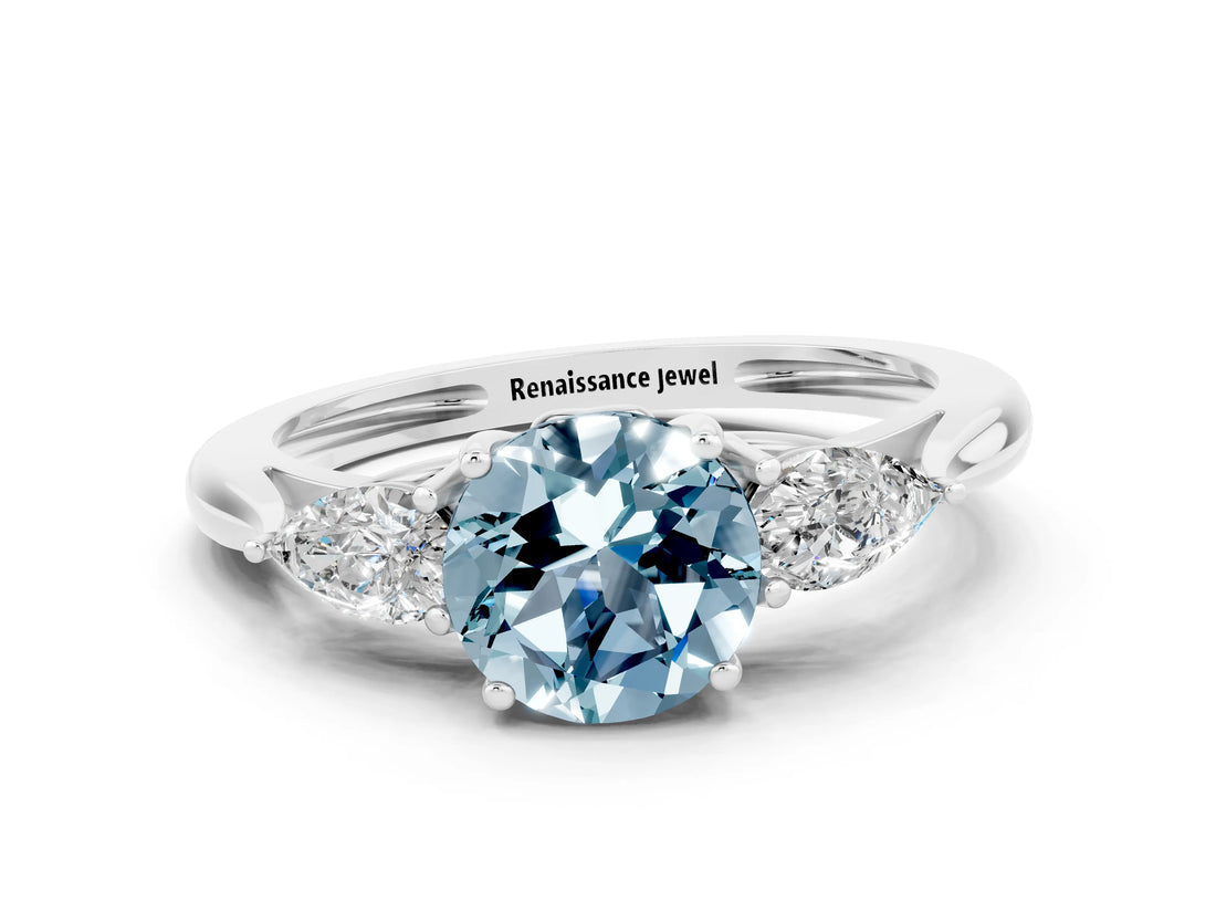 Platinum Three-Stone Round Cut Aquamarine Ring with Pear  Side Stones in Four-Prong Setting_54