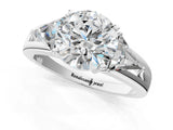 Platinum Three-Stone Round Cut Cut Diamond Ring with Trillion Side Stones on a Split Shank Band_14