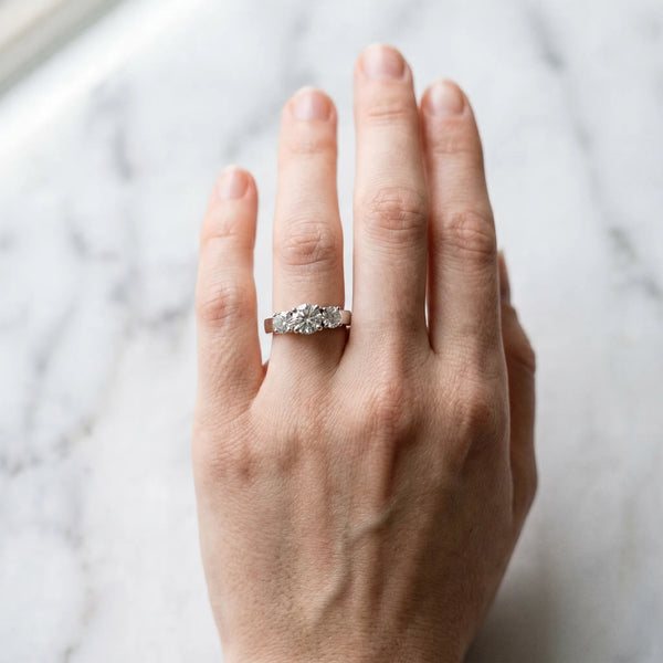 White gold Three-Stone Round Cut Diamond Engagement Ring with Flat Band and Four-Prong Setting