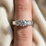 Platinum Three-Stone Round Cut Diamond Engagement Ring with Flat Band and Four-Prong Setting_43