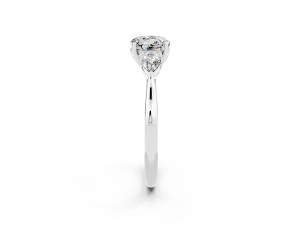 Platinum Three-Stone Round Cut Moissanite Ring with Pear  Side Stones in Four-Prong Setting