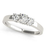 Platinum Three-Stone Round Diamond Solitaire Ring with Channel Set Band and Four-Prong Setting