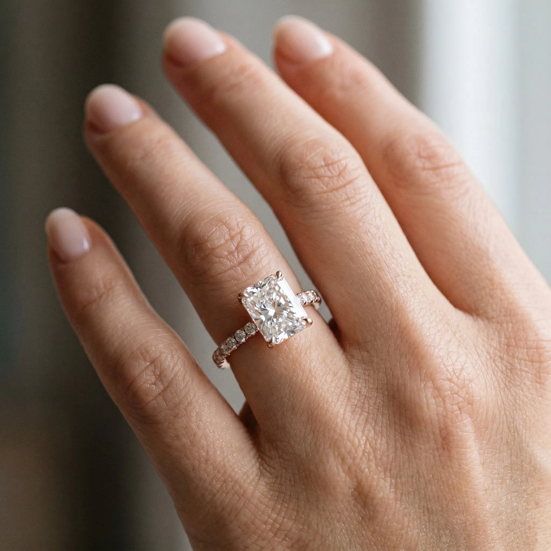 Rose gold 1 Carat Radiant Cut Diamond Solitaire Ring with Round  Pavé Band and Four-Prong Setting