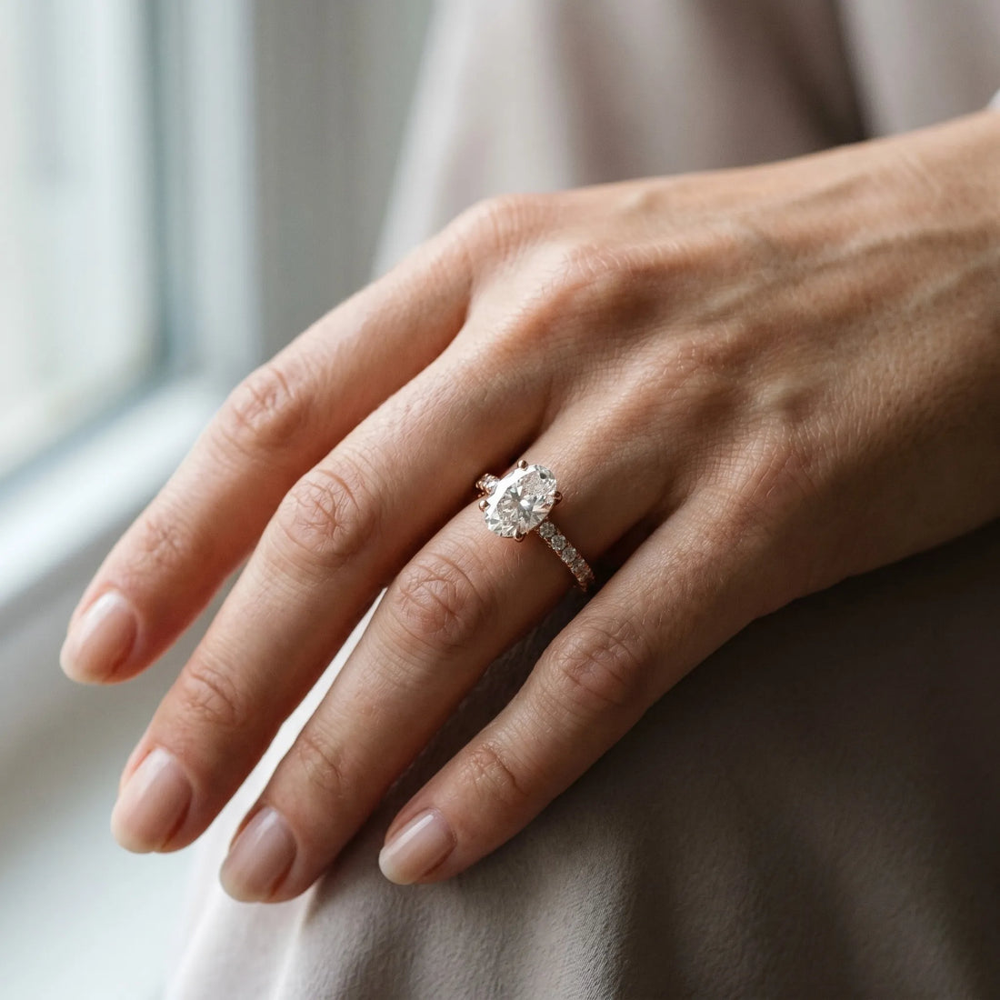 Rose gold 2 Carat Oval Cut Diamond Solitaire Ring with Round  Pavé Band and Four-Prong Setting