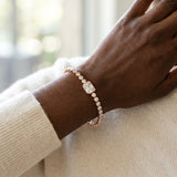 Rose gold Bezel-Set Round Diamond Tennis Bracelet with Radiant Center Diamond