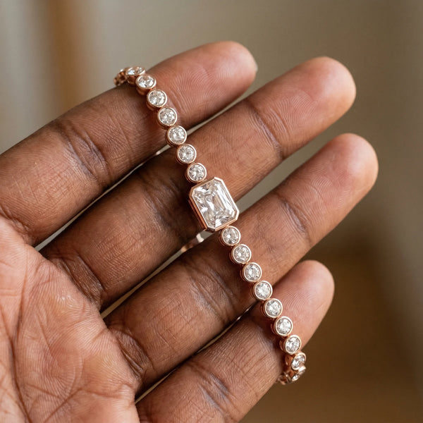 Rose gold Bezel-Set Round Diamond Tennis Bracelet with Radiant Center Diamond