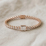 14K Rose Gold 7.03 Carat F VS1 Bezel-Set Round Diamond Tennis Bracelet with Radiant Center Diamond