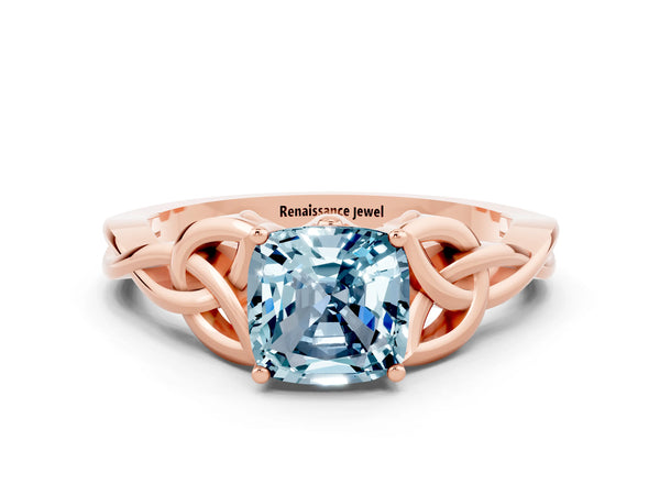 Rose gold Cushion Cut Aquamarine Solitaire Engagement Ring with Celtic Knot Band and Four-Prong Setting