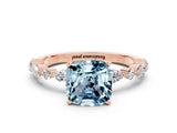 Rose gold Cushion Cut Aquamarine Solitaire with Side Stones on a Pavé Band and Four-Prong Setting