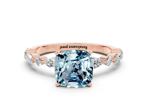 Rose gold Cushion Cut Aquamarine Solitaire with Side Stones on a Pavé Band and Four-Prong Setting