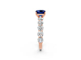 Rose gold Cushion Cut Blue Sapphire Prong Setting with Side Stones on a Pave Band_2