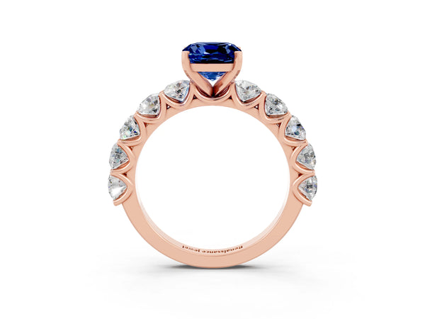 Rose gold Cushion Cut Blue Sapphire Prong Setting with Side Stones on a Pave Band