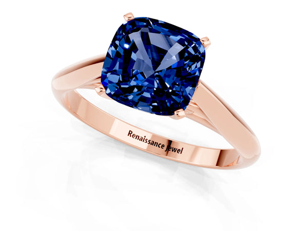 Rose gold Cushion Cut Blue Sapphire Solitaire Engagement Ring with Cathedral Setting and Four-Prong Mount