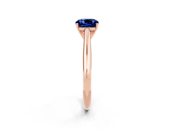 Rose gold Cushion Cut Blue Sapphire Solitaire Engagement Ring with Cathedral Setting and Four-Prong Mount