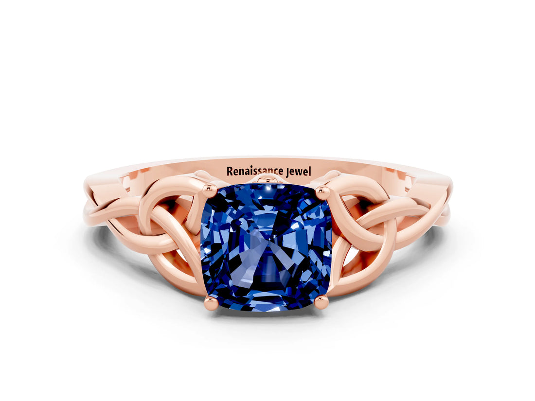 Rose gold Cushion Cut Blue Sapphire Solitaire Engagement Ring with Celtic Knot Band and Four-Prong Setting