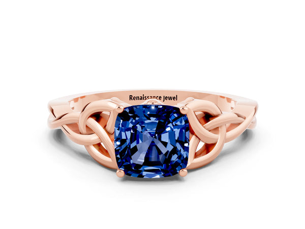 Rose gold Cushion Cut Blue Sapphire Solitaire Engagement Ring with Celtic Knot Band and Four-Prong Setting