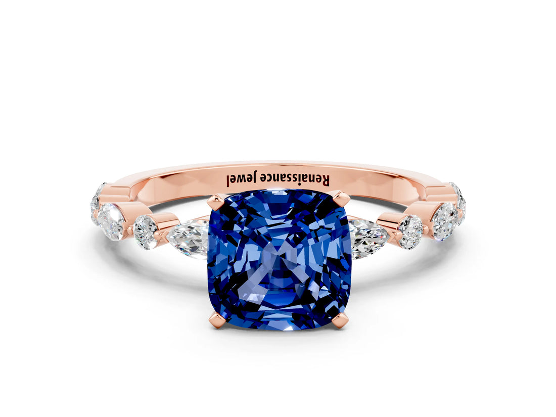 Rose gold Cushion Cut Blue Sapphire Solitaire with Side Stones on a Pavé Band and Four-Prong Setting