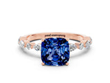 Rose gold Cushion Cut Blue Sapphire Solitaire with Side Stones on a Pavé Band and Four-Prong Setting