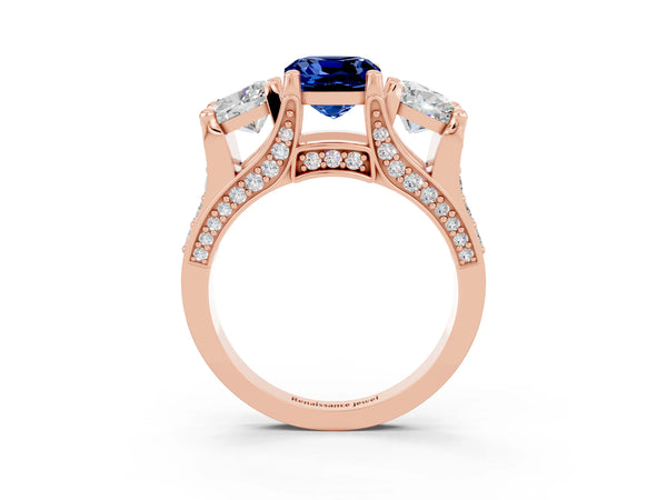 Rose gold Cushion Cut Blue Sapphire Three-Stone Ring with Channel Set Band and Four-Prong Setting