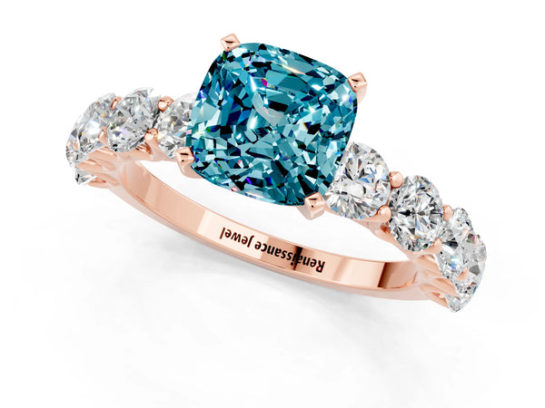 Rose gold Cushion Cut Blue Topaz Prong Setting with Side Stones on a Pave Band