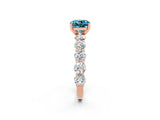 Rose gold Cushion Cut Blue Topaz Prong Setting with Side Stones on a Pave Band_2