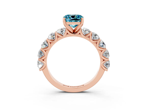 Rose gold Cushion Cut Blue Topaz Prong Setting with Side Stones on a Pave Band