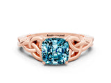Rose gold Cushion Cut Blue Topaz Solitaire Engagement Ring with Celtic Knot Band and Four-Prong Setting