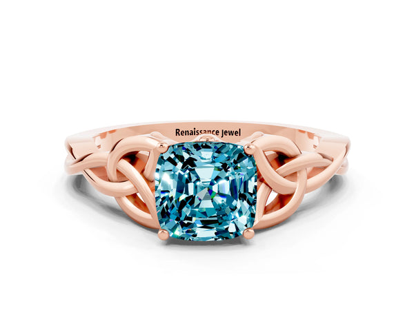 Rose gold Cushion Cut Blue Topaz Solitaire Engagement Ring with Celtic Knot Band and Four-Prong Setting