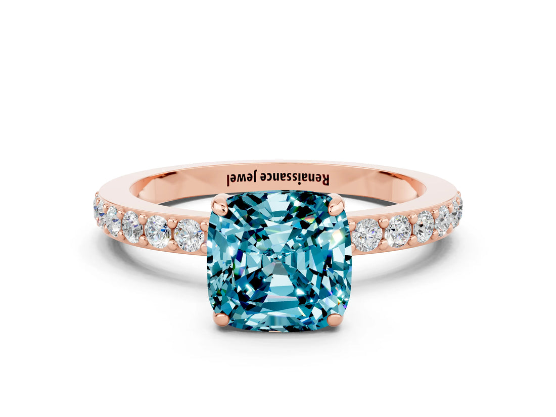 Rose gold Cushion Cut Blue Topaz Solitaire Engagement Ring with Pavé Band and Four-Prong Setting