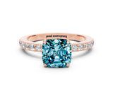 Rose gold Cushion Cut Blue Topaz Solitaire Engagement Ring with Pavé Band and Four-Prong Setting
