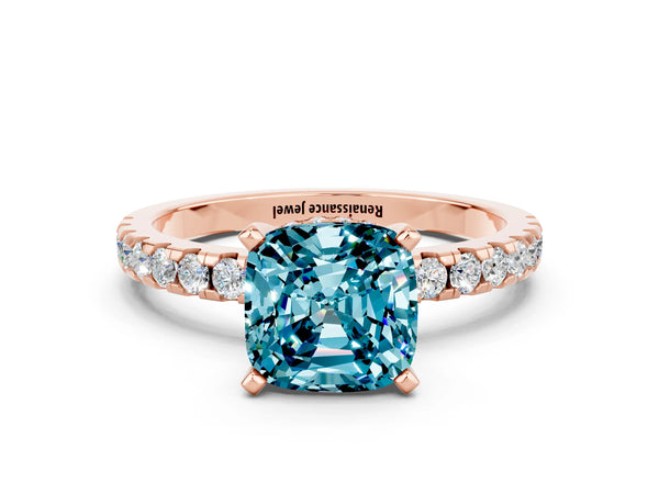 Rose gold Cushion Cut Blue Topaz Solitaire Ring with Round Pavé Band and Four-Prong Setting